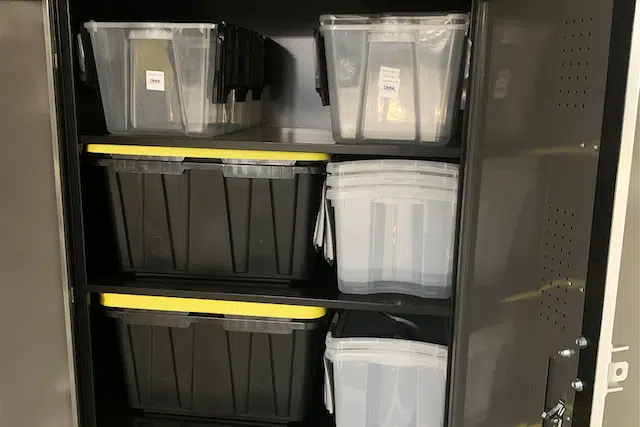 Spacious resident storage locker with shelving for additional household storage.